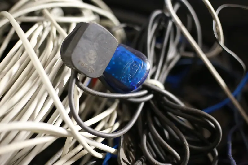 Tangle of cables and plugs collected for recycling