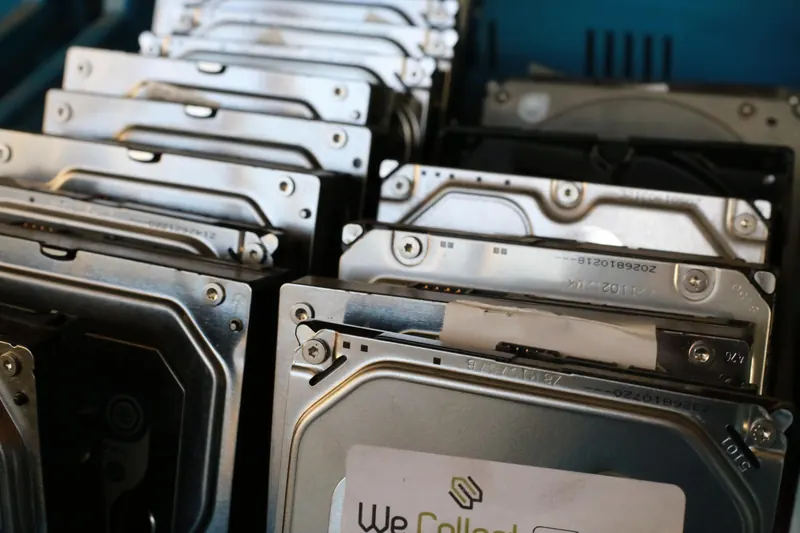 Hard drives removed from computers and waiting to be destroyed