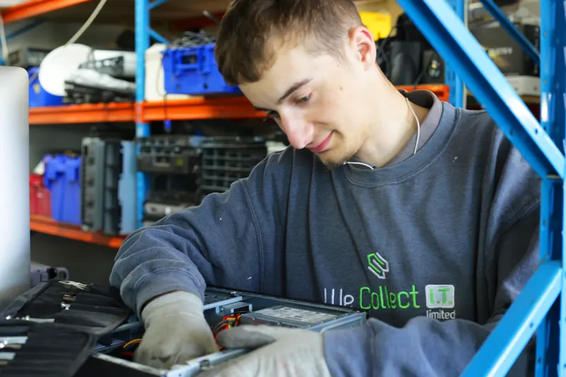 Technician refurbishing a computer